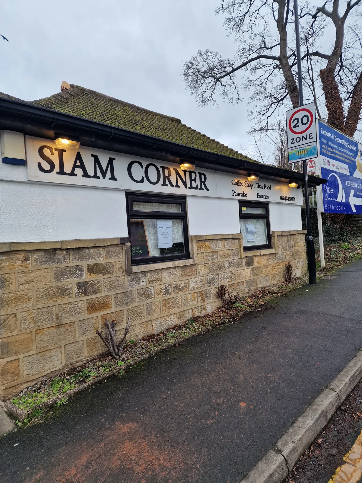 The Siam Corner shopfront and sign at 1 Station Road in Guiseley