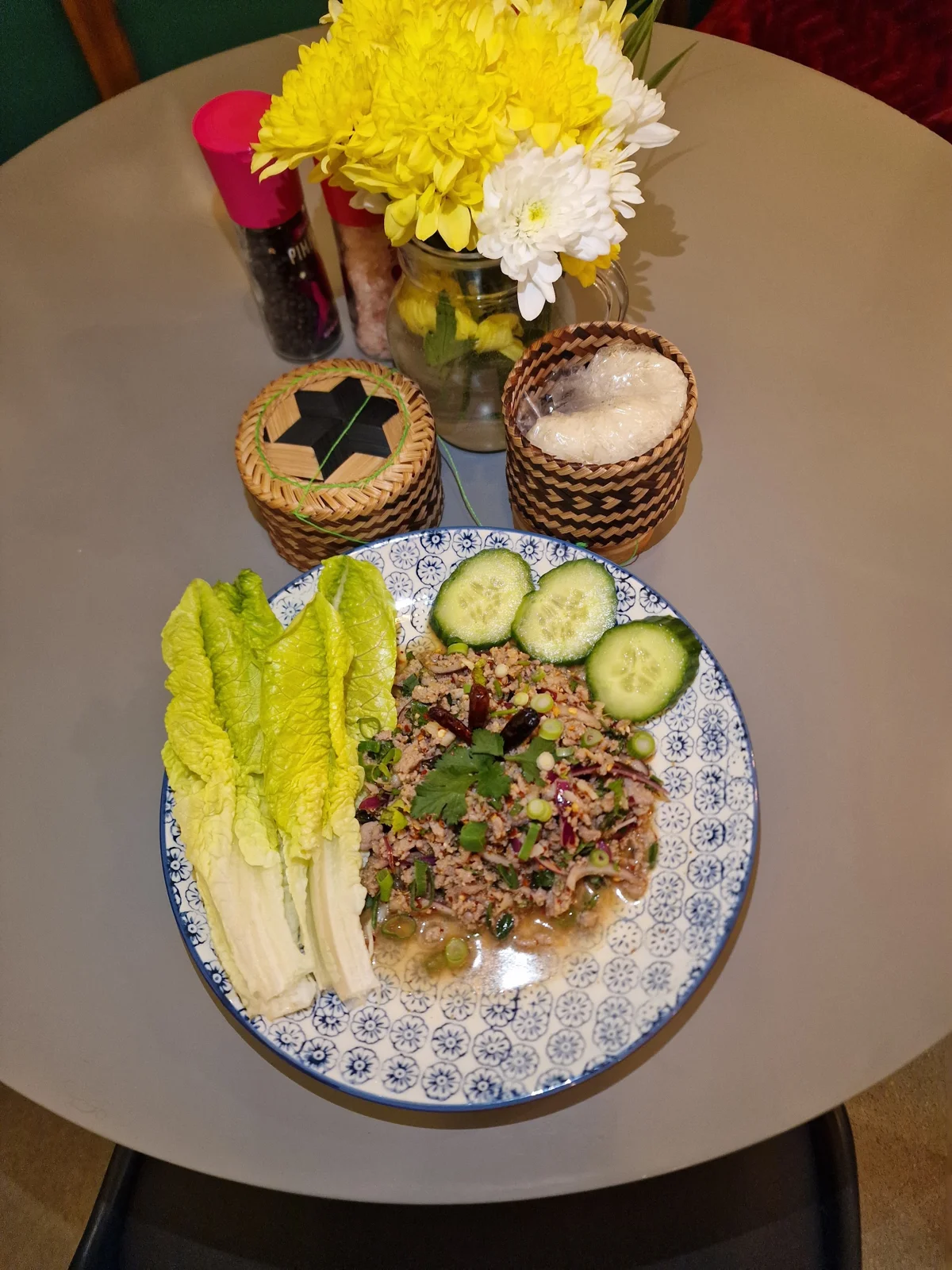 Thai food served at a flower-filled table in Siam Corner