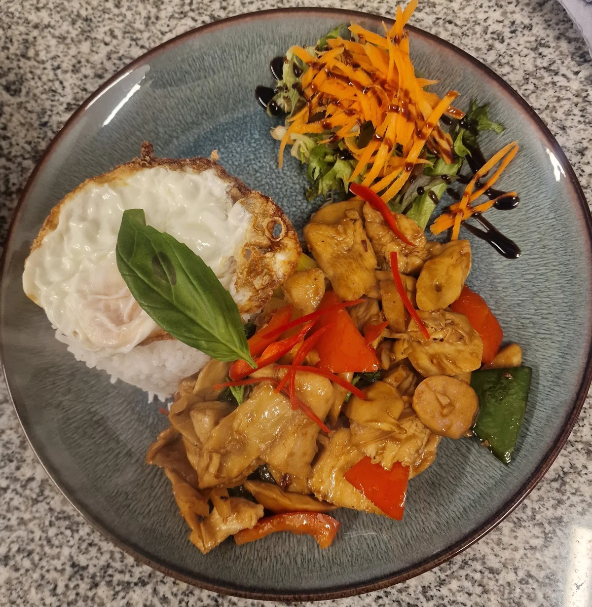 A freshly served Thai stir-fry and rice at Siam Corner