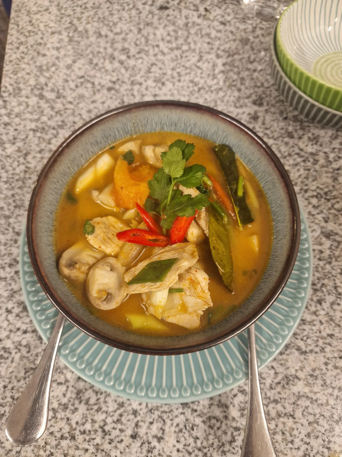 A bowl of Thai curry with colourful vegetables at Siam Corner