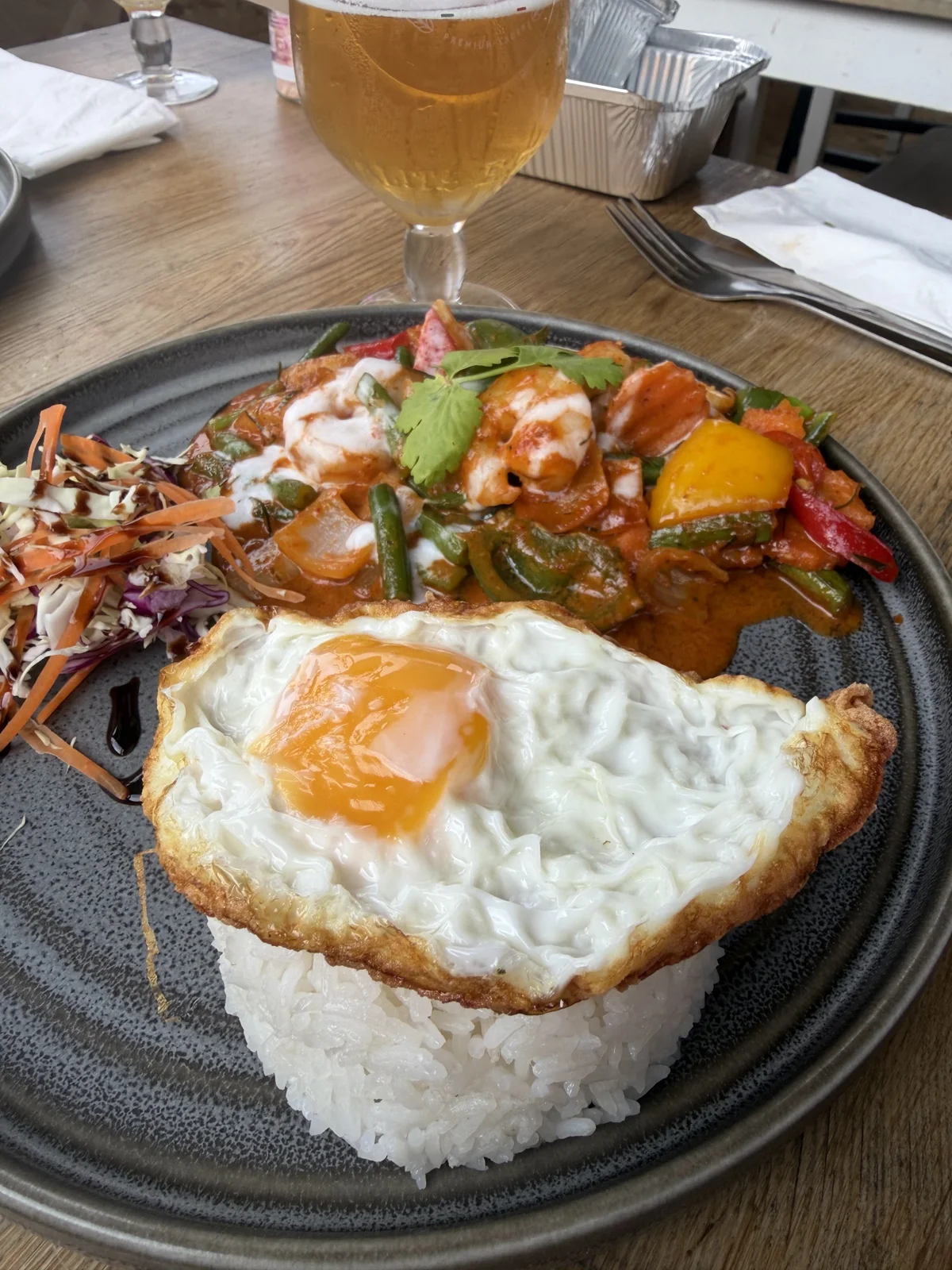 Thai food with rice and a fried egg at Siam Corner