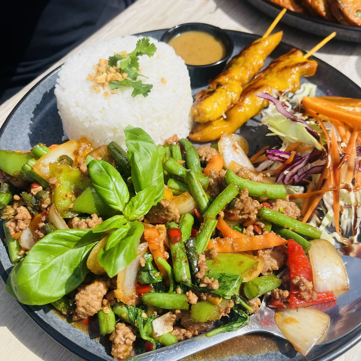 A selection of Thai dishes, satay and rice served at Siam Corner
